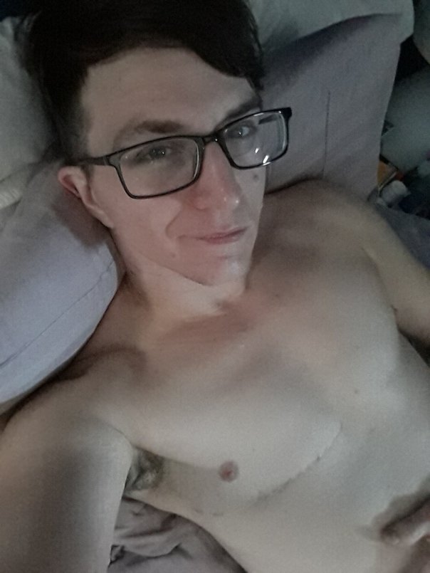 Me, relaxing, shirtless, on some pillows